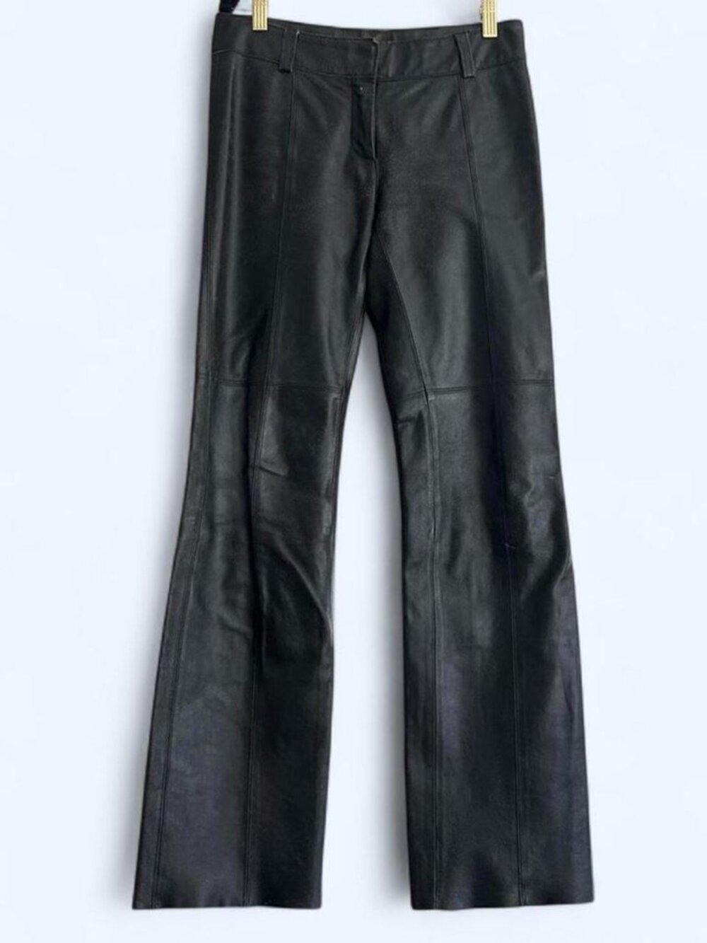 Black leather vintage low rise bootcut pants with zipper and button closure. Siz